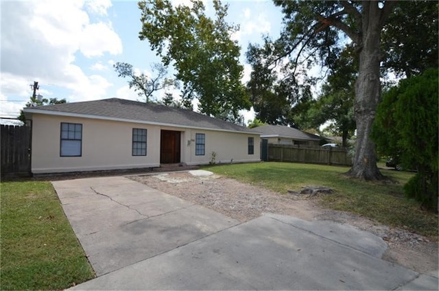 back of house featuring a patio area and a lawn