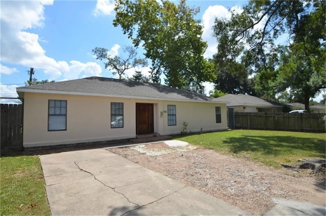 view of front of property with a patio and a front lawn