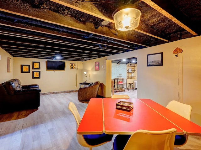 dining space with hardwood / wood-style floors