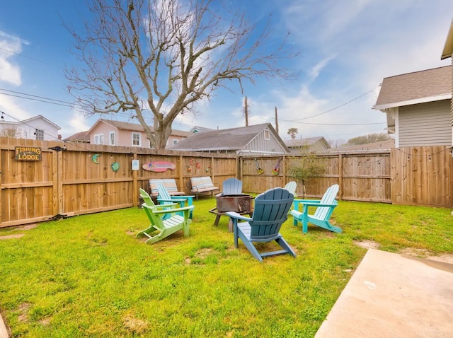 view of yard with an outdoor fire pit and a patio area