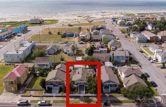 aerial view featuring a water view and a beach view