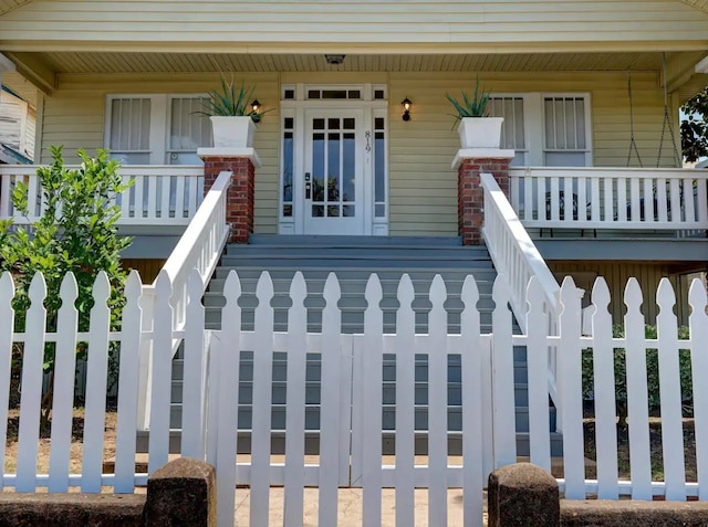 property entrance featuring covered porch