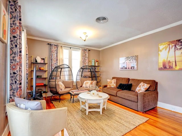 living room featuring ornamental molding and hardwood / wood-style flooring