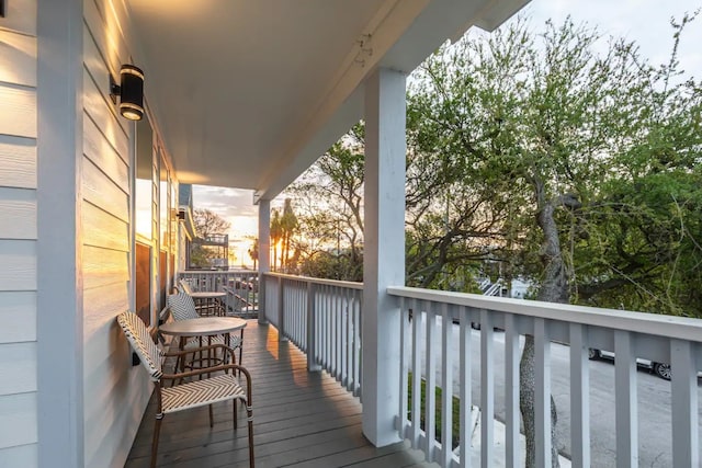 balcony at dusk with a porch