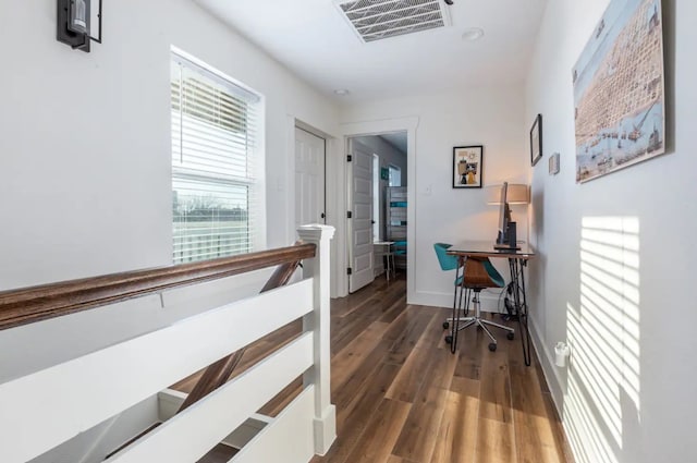 hall with dark hardwood / wood-style floors