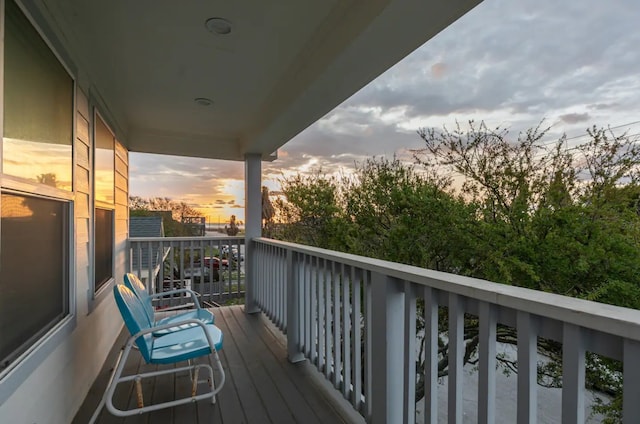 view of balcony at dusk