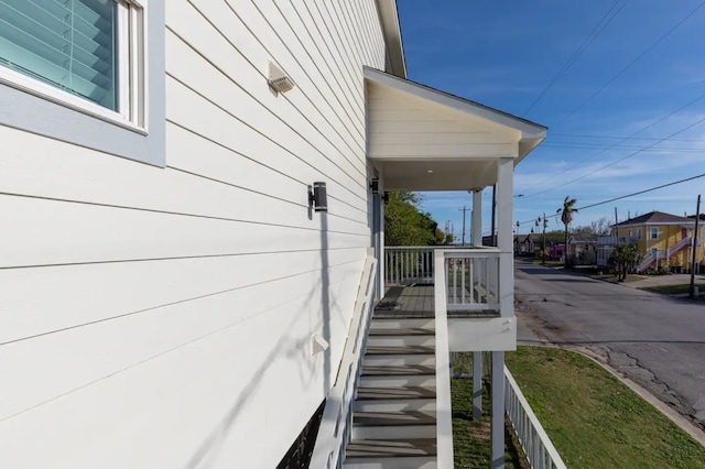 view of property exterior with covered porch