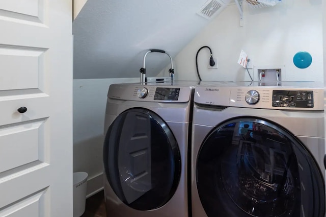 laundry room with washer and dryer