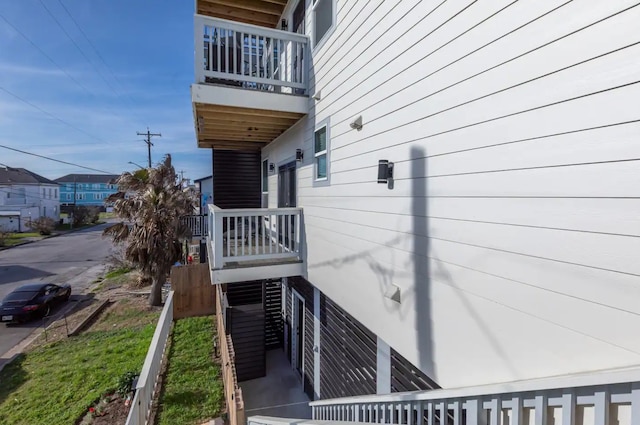 view of side of property featuring a balcony