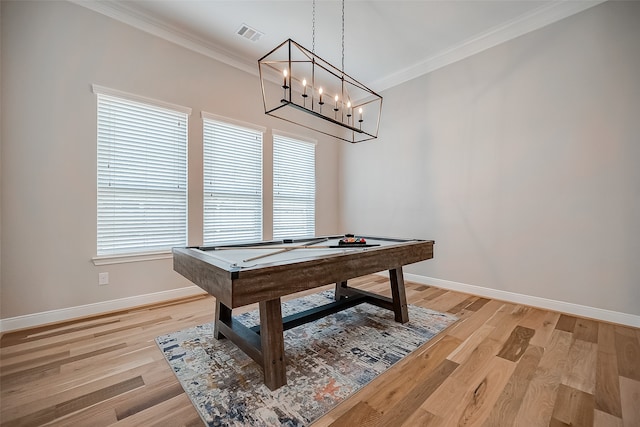 rec room with ornamental molding, billiards, and light wood-type flooring