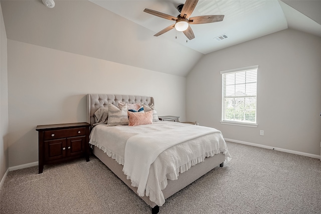 carpeted bedroom featuring ceiling fan and vaulted ceiling