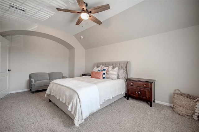 bedroom featuring light carpet, ceiling fan, and vaulted ceiling