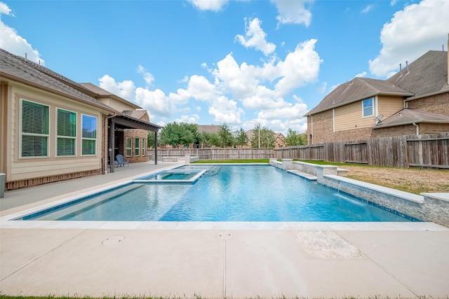 view of swimming pool featuring an in ground hot tub and a patio