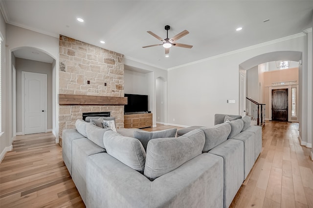 living room featuring ornamental molding and light hardwood / wood-style flooring