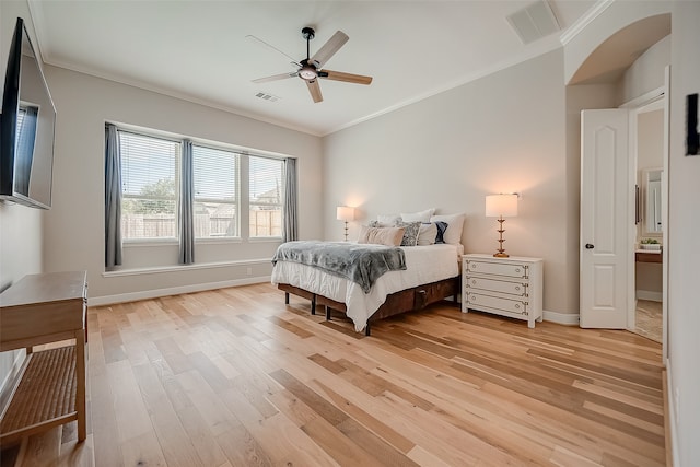 bedroom with crown molding, light wood-type flooring, and ceiling fan