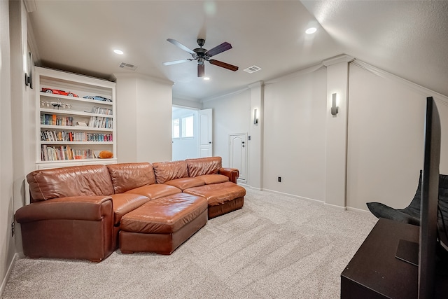 living room with carpet flooring, ornamental molding, lofted ceiling, and ceiling fan