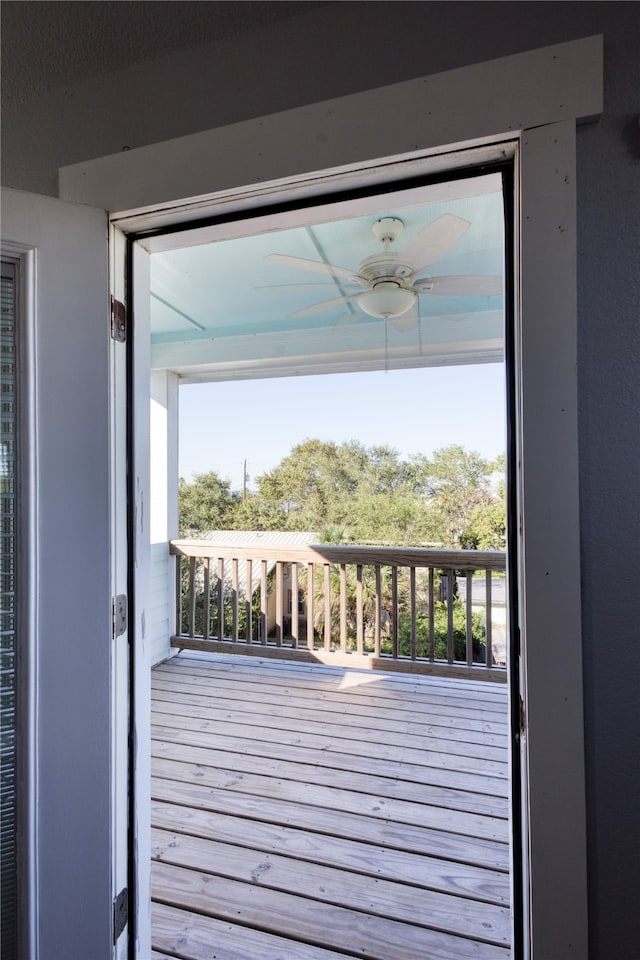 doorway to outside with a healthy amount of sunlight, hardwood / wood-style flooring, and ceiling fan