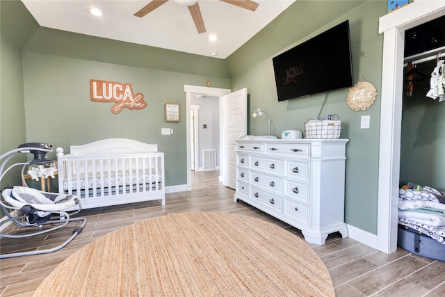 bedroom with recessed lighting, wood finish floors, visible vents, and baseboards