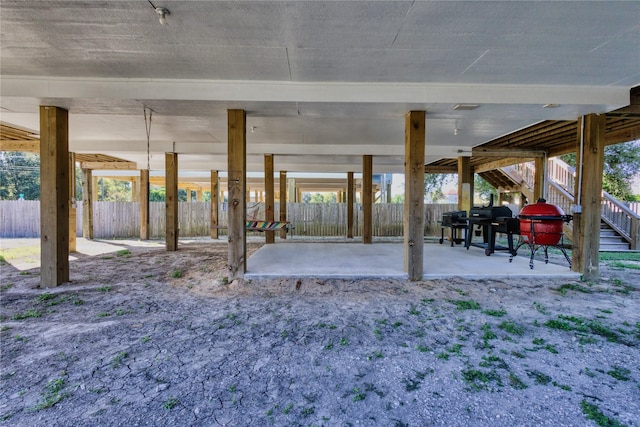 view of patio / terrace featuring fence