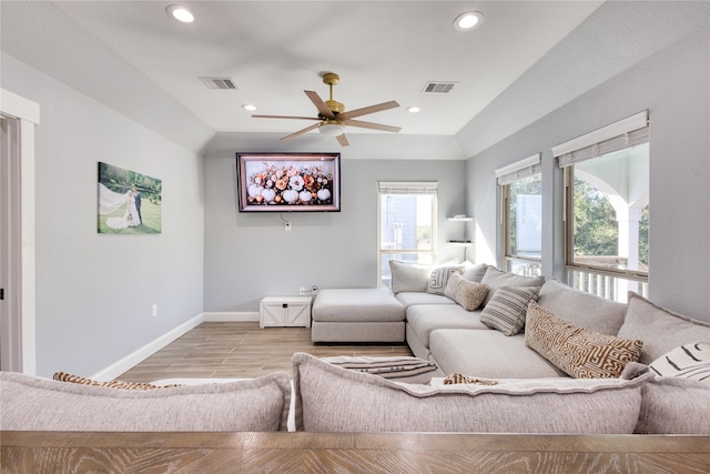 living room with light wood-type flooring and ceiling fan