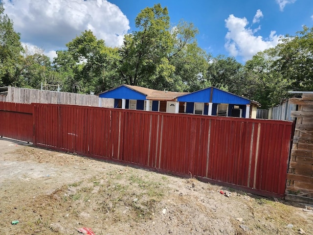 view of gate featuring fence