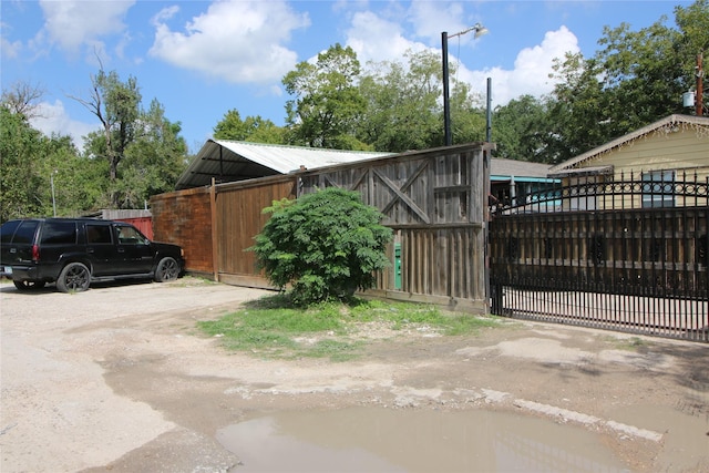 view of gate with fence