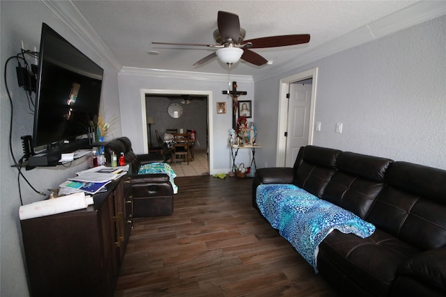 living room with crown molding, ceiling fan, a textured ceiling, and dark hardwood / wood-style flooring