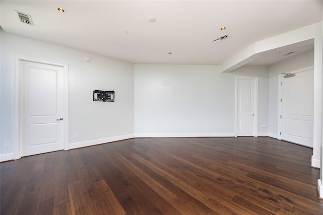 spare room with dark hardwood / wood-style flooring