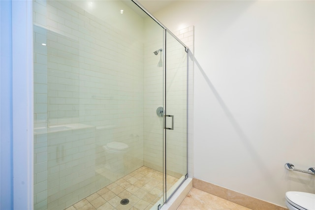 bathroom featuring tile patterned floors, toilet, and walk in shower