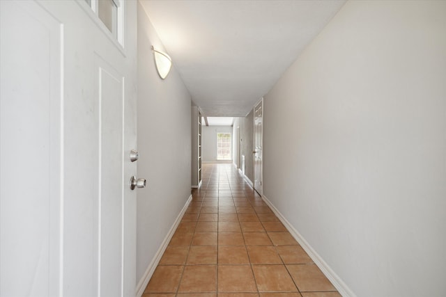 hallway featuring light tile patterned floors