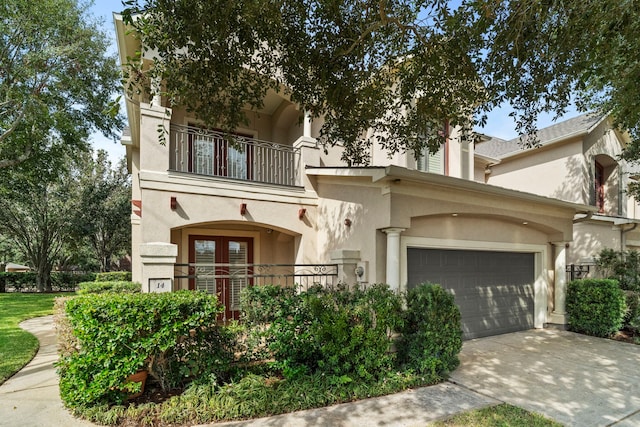 view of front of house with a balcony and a garage