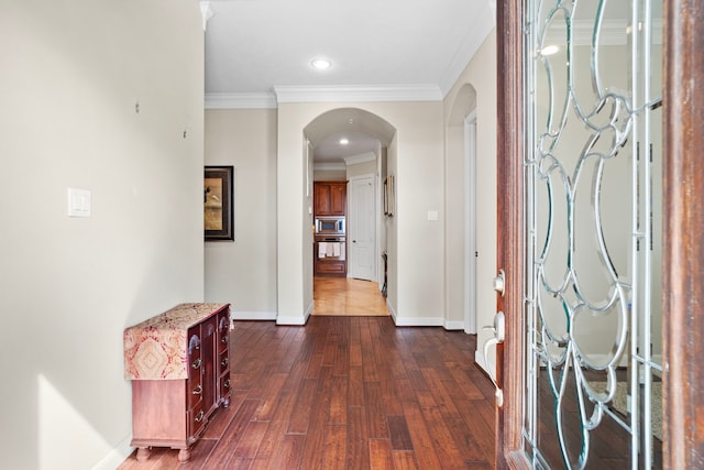 hall featuring crown molding and dark hardwood / wood-style flooring