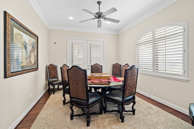 dining room with crown molding, french doors, dark wood-type flooring, and ceiling fan