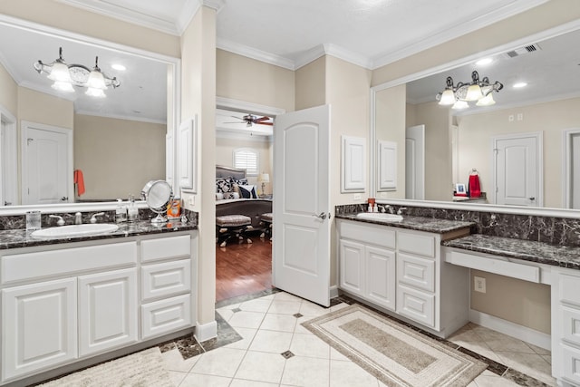 bathroom featuring vanity, crown molding, ceiling fan, and hardwood / wood-style floors