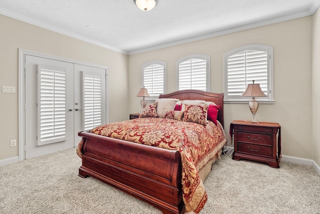 bedroom featuring crown molding and light carpet