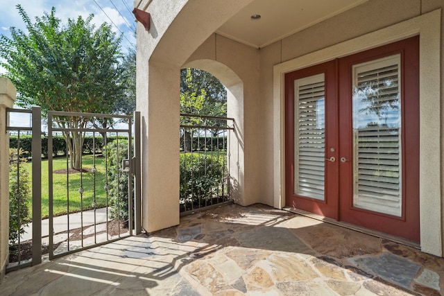 entrance to property with a lawn