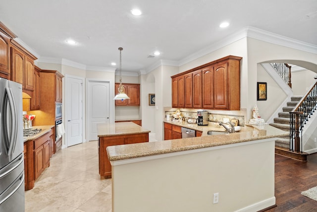 kitchen featuring a kitchen island, backsplash, kitchen peninsula, stainless steel appliances, and light hardwood / wood-style flooring