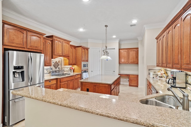 kitchen featuring appliances with stainless steel finishes, sink, a center island, hanging light fixtures, and light stone counters