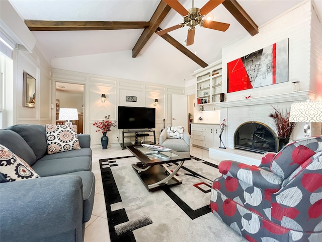 tiled living room featuring beamed ceiling, a fireplace, and high vaulted ceiling