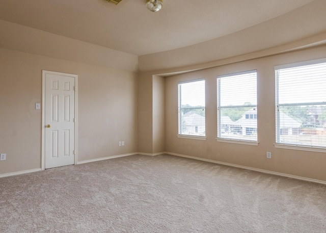 spare room with light colored carpet