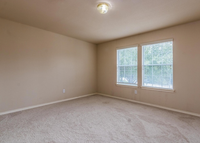 empty room with light colored carpet