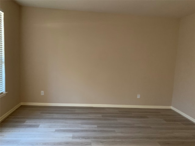 spare room featuring light hardwood / wood-style flooring