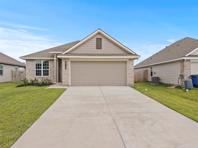 ranch-style house with cooling unit, a garage, and a front yard