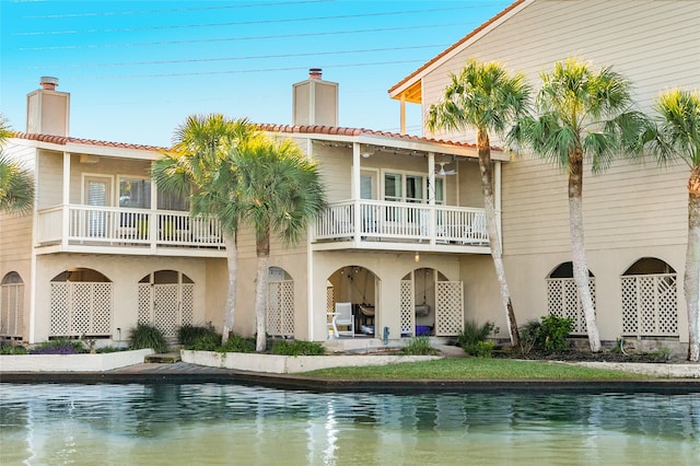 back of house with a balcony