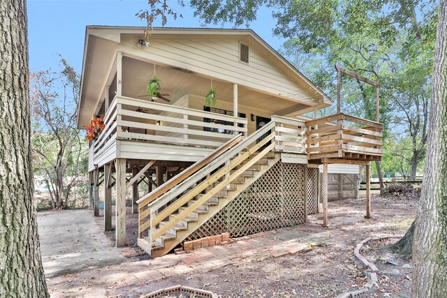 rear view of property featuring a deck