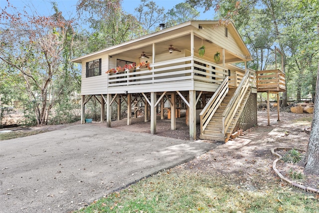 rear view of house featuring ceiling fan