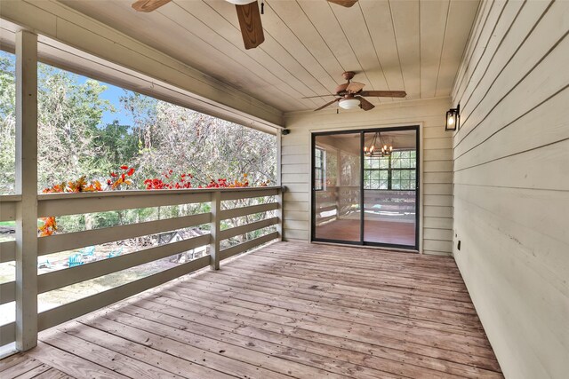 wooden terrace featuring ceiling fan