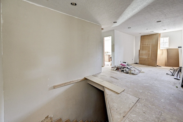 interior space with a textured ceiling