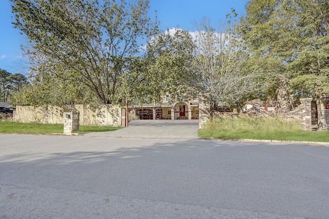 view of property hidden behind natural elements