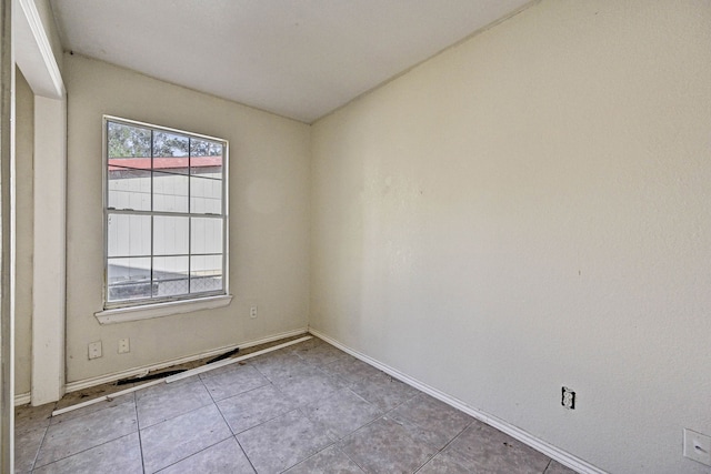 view of tiled spare room